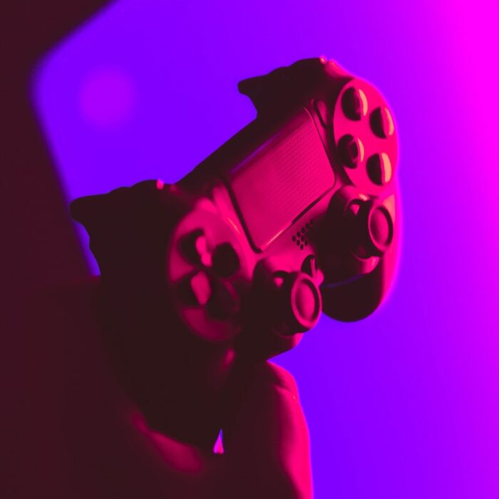 person holding black and gray game controller